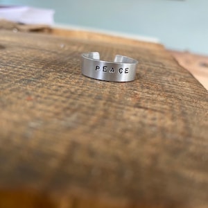 Hand stamped personalised silver aluminium adjustable cuff ring jewellery ‘Peace’ fun slogan birthday Christmas valentines fun gift x