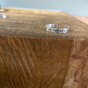 Hand stamped personalised silver colour cuff aluminium keepsake adjustable ring birthday gift fan ‘we’ll be alright’ phrase!x
