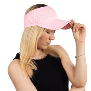 May include: A pink visor with a mesh panel on the top. The visor is made of a soft, breathable material and has a curved brim.