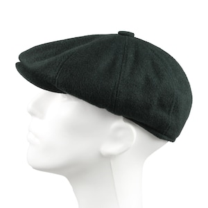 May include: A dark green wool newsboy cap with a slightly rounded crown and a short brim.