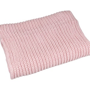 May include: A soft, pink knitted throw blanket with a ribbed texture.