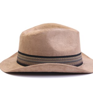 May include: A brown suede fedora hat with a black and multi-colored striped band.