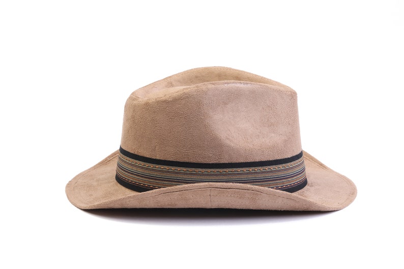 May include: A brown suede fedora hat with a black and multi-colored striped band.