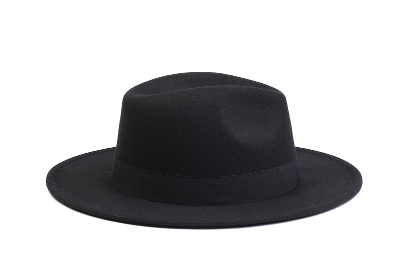 May include: A black fedora hat with a wide brim and a black ribbon band.