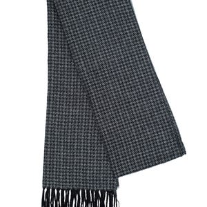 May include: A black and gray patterned scarf with black fringe.