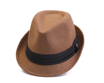 May include: A brown fedora hat with a black band and a small button on the side.