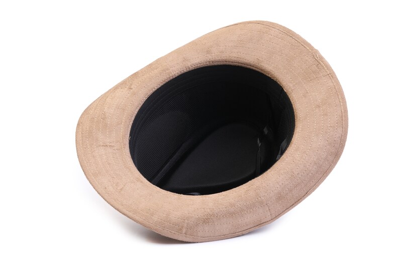 May include: A brown suede fedora hat with a black mesh lining. The hat is turned inside out, showing the lining.