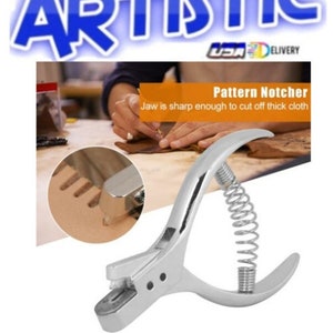 May include: A silver metal pattern notcher tool featuring a spring-loaded handle mechanism. The tool is designed for cutting notches into fabric, as shown in the circular inset image. The text Pattern Notcher is visible on the product packaging.