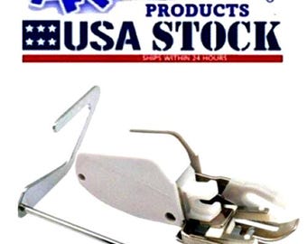 May include: A sewing machine foot with a white plastic base and silver metal components. The image also includes a metal bar and a metal piece with a hook. The text "ARTISTIC PRODUCTS USA STOCK" is visible in the background.