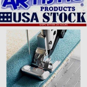 May include: A close-up of a sewing machine in action, stitching a piece of teal fabric. The machine's needle is piercing the fabric, guided by a silver presser foot. The image includes text that reads "ARTISTIC PRODUCTS USA STOCK".