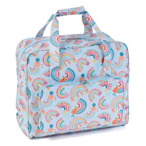 May include: A light blue tote bag featuring a repeating pattern of rainbows in various colours. The bag has a front zipped pocket, top handles, and a shoulder strap. The design includes orange, yellow, pink, and teal colours.