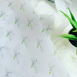 May include: White tissue paper with a repeating pattern of a green leaf and the text "Balance & Root Placenta Series".