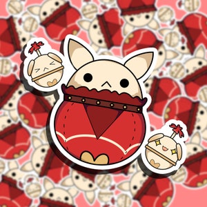 May include: A sticker sheet featuring a cartoon character with a rabbit-like face and a red outfit. The character has a cream-colored face and ears, with black eyes and a small mouth. Two smaller stickers of a similar character are also included.