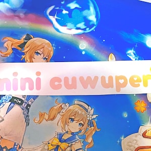 May include: A white sticker with the text "mini cuuper" in pink letters and a yellow heart.