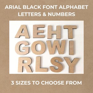 May include: A collection of tan, flat, wooden alphabet letters and numbers in an Arial Black font style. The characters are arranged in three rows on a white background. The text ARIAL BLACK FONT ALPHABET LETTERS & NUMBERS and 3 SIZES TO CHOOSE FROM is visible.