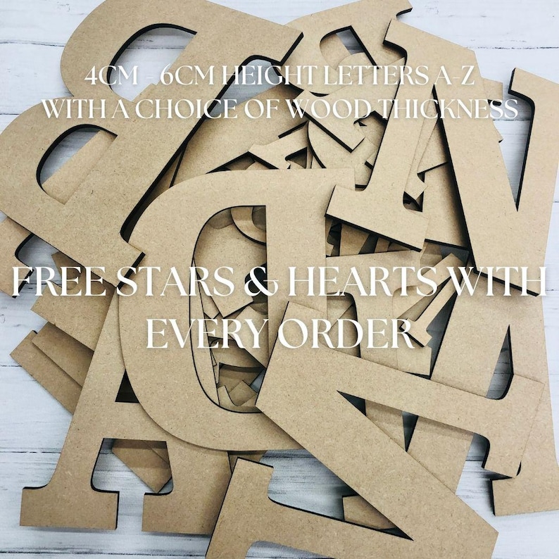 May include: A collection of unfinished light brown wooden letters in various sizes, featuring the text 4CM - 6CM HEIGHT LETTERS A-Z WITH A CHOICE OF WOOD THICKNESS and FREE STARS & HEARTS WITH EVERY ORDER printed over the stacked alphabet pieces.