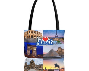 Könnte beinhalten: Eine weiße Tragetasche mit schwarzen Henkeln, die eine Collage berühmter französischer Wahrzeichen zeigt. Das Design umfasst den Eiffelturm, den Arc de Triomphe und den Louvre, mit dem Text "I love France".