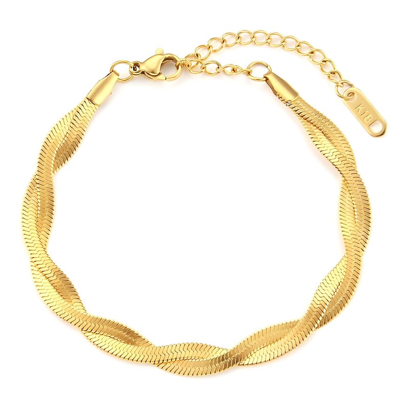 May include: A gold-tone snake chain bracelet with a lobster clasp closure. The bracelet has a delicate, feminine design and is perfect for everyday wear.