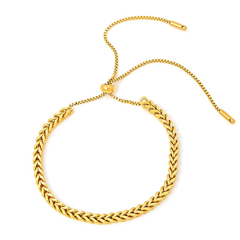 May include: A gold chain bracelet with a braided design and an adjustable sliding clasp.