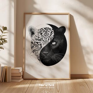 May include: Framed art print depicting a black panther and a leopard in a yin-yang design. The leopard has black spots on a white background, and the panther is solid black. The artwork is set against a neutral background with the text "Tiger of Paris" at the bottom.