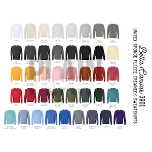 以下が含まれることがあります： 様々な色のBella Canvas 3901ユニセックススウェットシャツのディスプレイ。白、ナチュラル、ヘザーダスト、シルバー、アッシュ、アスレチックヘザーなどの色があります。「Bella Canvas 3901」の文字が見えます。