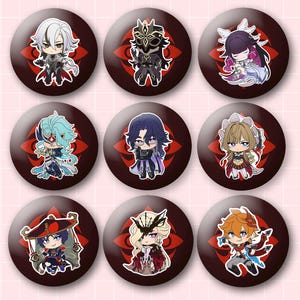May include: A set of nine circular pin-back buttons featuring chibi-style anime characters. Each button has a dark red background with a black floral-like emblem. The characters display various outfits and hairstyles in a colorful, illustrated design.