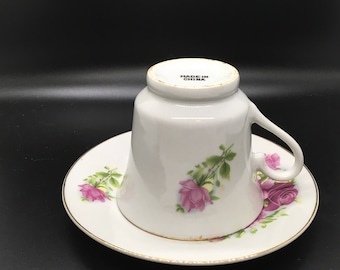 Cup and matching saucer with floral print