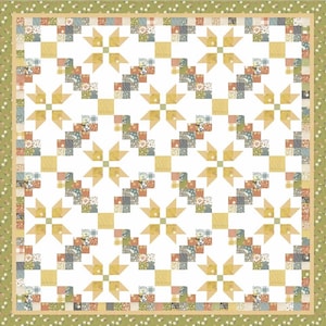 Könnte beinhalten: Ein Patchwork-Quilt mit einem sich wiederholenden Muster aus gelben, blauen und floralen Quadraten auf weißem Hintergrund. Der Quilt hat einen grünen Blumenrand und einen gelben Innenrand. Das Design zeigt geometrische Formen und ein symmetrisches Layout.