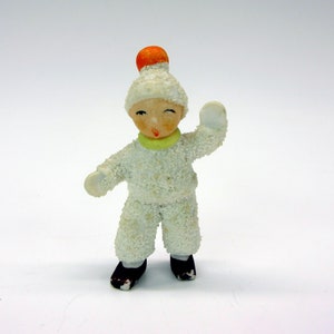 Unusual antique German bisque snow baby cake decoration of a round head boy