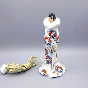 Art Decp Goebel porcelain figural perfume lamp of Flapper with fancy robe