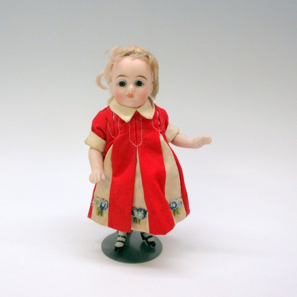 Antique German all bisque doll with moving head and glass eyes 5 1/4" tall