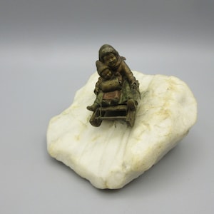 Great antique Vienna bronze figurine of Children on a sled sledding down a snowy hill