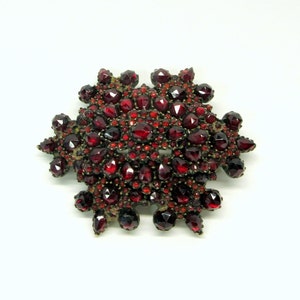 Large antique Bohemian faceted garnet snowflake brooch with 14k gold pin