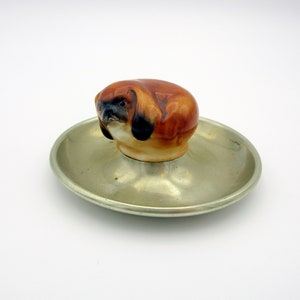 Royal Doulton porcelain curled Pekinese puppy dog on base HN 835