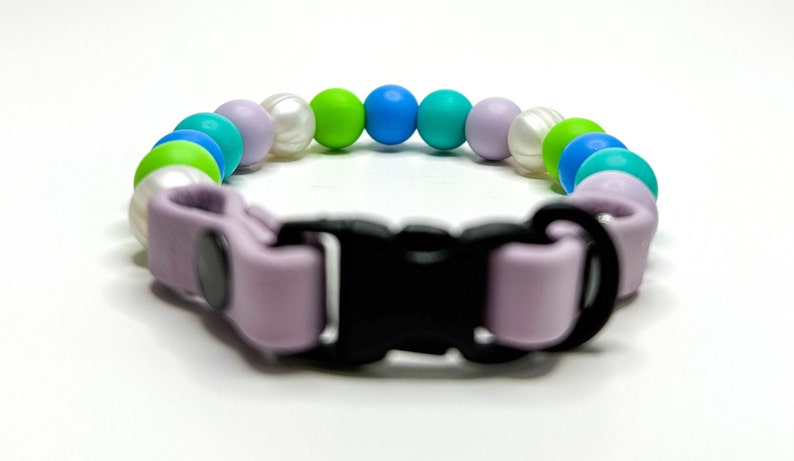 Breakaway bead cat collar made with pearl, lime green, light blue, teal and lilac silicone beads paired with lilac biothane