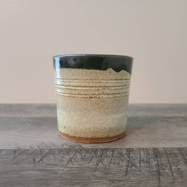 Small Cream and Black Pottery Vase 3 inches by 3 and one fourths inches