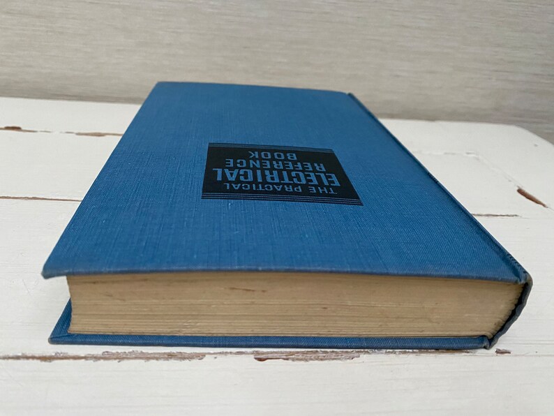 May include: A blue hardcover book with the title "The Practical Electrical Reference Book" printed on the spine.