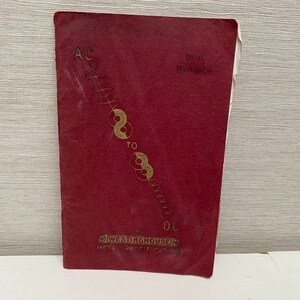 May include: A red booklet with the text "AC to DC" in gold lettering. The booklet is titled "Westinghouse Meta Rectifier" and has a diagram of a circuit.