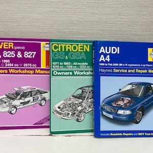 Può includere: Tre manuali di riparazione auto Haynes. Il primo è viola e presenta una Rover 820, 825 e 827. Il secondo è verde e presenta una Citroën GS e GSA. Il terzo è blu e presenta una Audi A4.