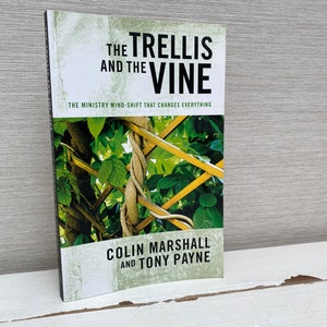 May include: A book titled "The Trellis and the Vine: The Ministry Mind-Shift That Changes Everything" by Colin Marshall and Tony Payne. The cover features a close-up of a vine growing on a trellis.
