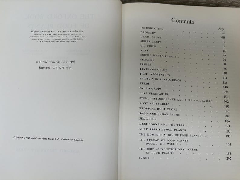 May include: Open book with the title "The Oxford Book of Food Plants" and a table of contents. The book was published in 1969 by Oxford University Press. The contents include topics like fruits, herbs, and root vegetables.