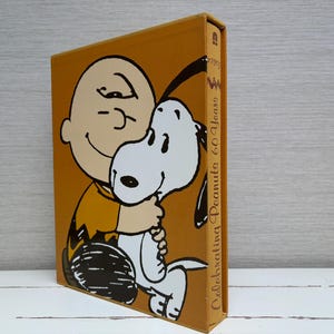 Celebrating Peanuts: 60 Years by Charles M Schulz Hardcover Book