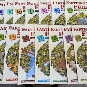 May include: A collection of 20 colorful comic books featuring the Farthing Wood Friends. The books are numbered 1 through 20 and have a nature theme. The cover of the last book features a badger with the text "Farthing Wood Friends" and "Nature Fun and Learn".
