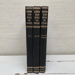 May include: Three black hardback books titled "Modern High-Speed Oil Engines" with gold lettering. The books are volumes I, II, and III, with volume III including an index. The books are published by Caxton.
