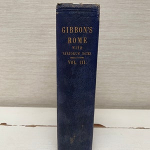 May include: A blue hardcover book titled "Gibbon's Rome with Variorum Notes Vol. III."