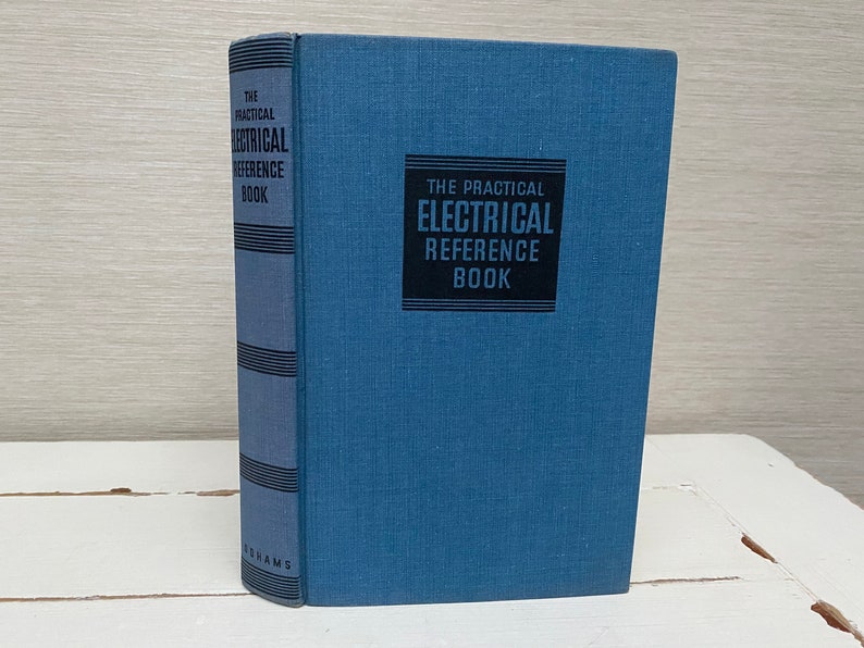 May include: A blue hardcover book titled "The Practical Electrical Reference Book" with black text and a black border around the title.