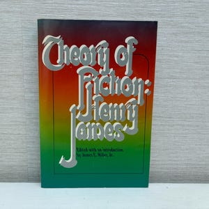 May include: A book titled "Theory of Fiction: Henry James" with a rainbow gradient cover. The book is edited with an introduction by James E. Miller Jr.