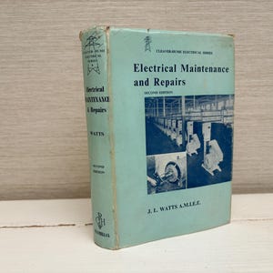 May include: A vintage book titled "Electrical Maintenance and Repairs" by J.L. Watts, A.M.I.E.E. The book has a light blue cover with black text and illustrations. The cover also includes the text "Cleaver-Hume Electrical Series" and "Second Edition."