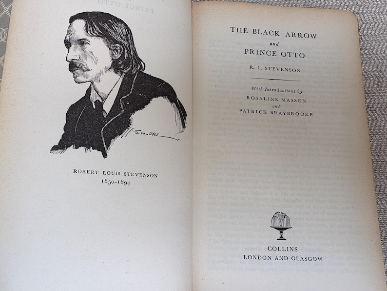 May include: An open book featuring a black and white portrait of Robert Louis Stevenson and the title "The Black Arrow and Prince Otto." The book's pages are aged, with text and illustrations.