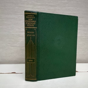 May include: A green hardback book with gold lettering on the spine. The title is "Funk & Wagnalls New Standard Encyclopedia" and the volume number is "XXV". The book is titled "Wash-Zyzn".
